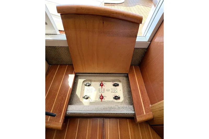 Pilot House Yacht Photos Pics Control panel on 2003 Sealine F42/5 yacht, featuring wooden interior design.