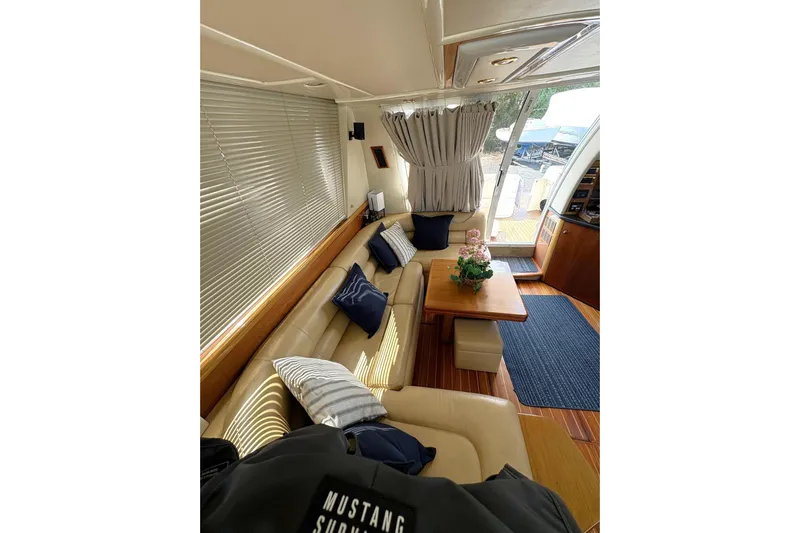 Pilot House Yacht Photos Pics Luxurious interior of 2003 Sealine F42/5 yacht with elegant seating and decor.