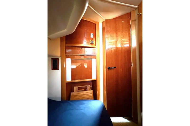 Pilot House Yacht Photos Pics Interior of 2003 Sealine F42/5 yacht with wooden cabinetry and door.