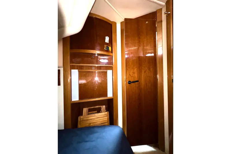 Pilot House Yacht Photos Pics Interior of 2003 Sealine F42/5 yacht with wooden cabinetry and door.