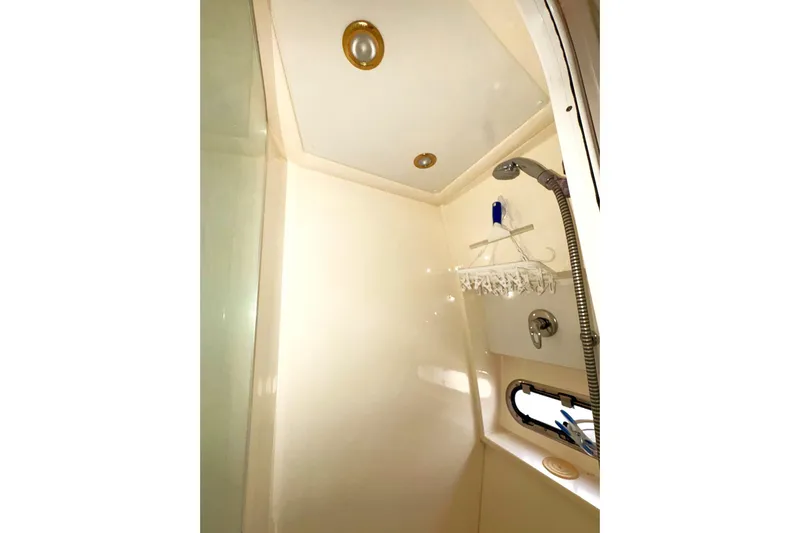 Pilot House Yacht Photos Pics Shower area in 2003 Sealine F42/5 yacht, featuring modern fixtures and storage.