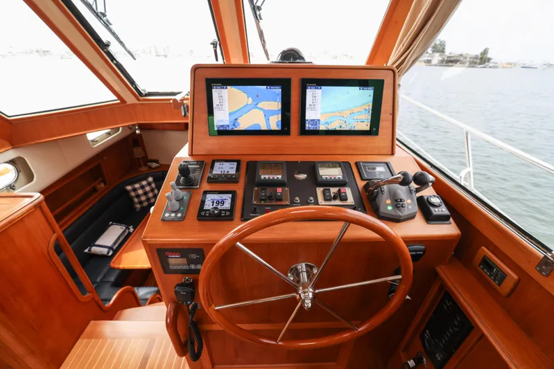 Aryeh Yacht Photos Pics Helm of 2008 Grand Banks EASTBAY 39 SX with navigation screens and controls.