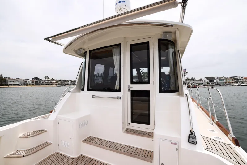 Aryeh Yacht Photos Pics 2008 Grand Banks EASTBAY 39 SX yacht with sleek deck and waterfront view.