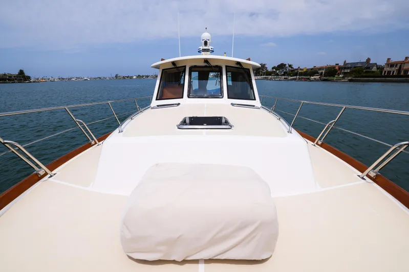 Aryeh Yacht Photos Pics 2008 Grand Banks EASTBAY 39 SX yacht on calm waters, showcasing sleek deck design.