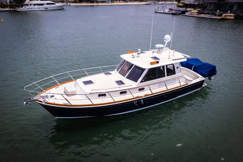 Aryeh Yacht Photos Pics 2008 Grand Banks EASTBAY 39 SX yacht on calm water, showcasing sleek design and luxury.