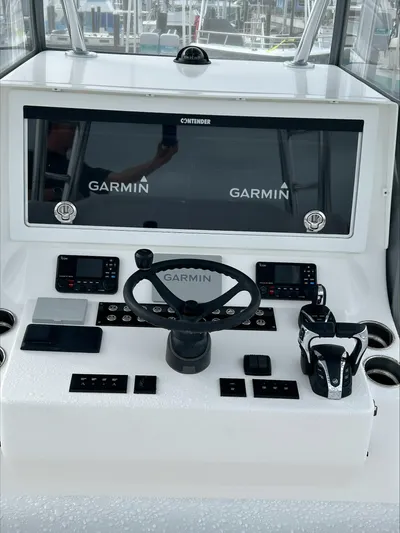  Yacht Photos Pics 2023 Contender 39 ST boat dashboard with Garmin navigation system.