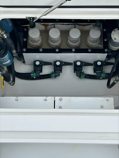  Yacht Photos Pics Contender 39 ST 2023 boat engine compartment with fuel filters and hoses.