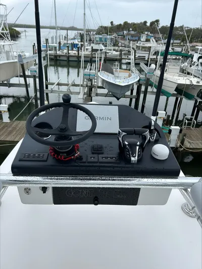  Yacht Photos Pics Helm of 2023 Contender 39 ST boat with Garmin navigation, docked at marina.