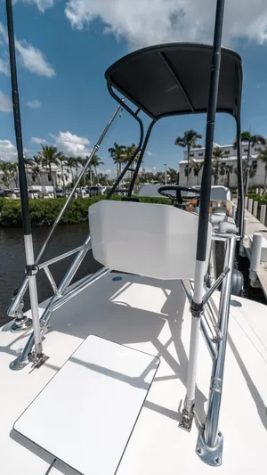  Yacht Photos Pics 2023 Contender 39 ST boat with sleek design, docked under a sunny sky.