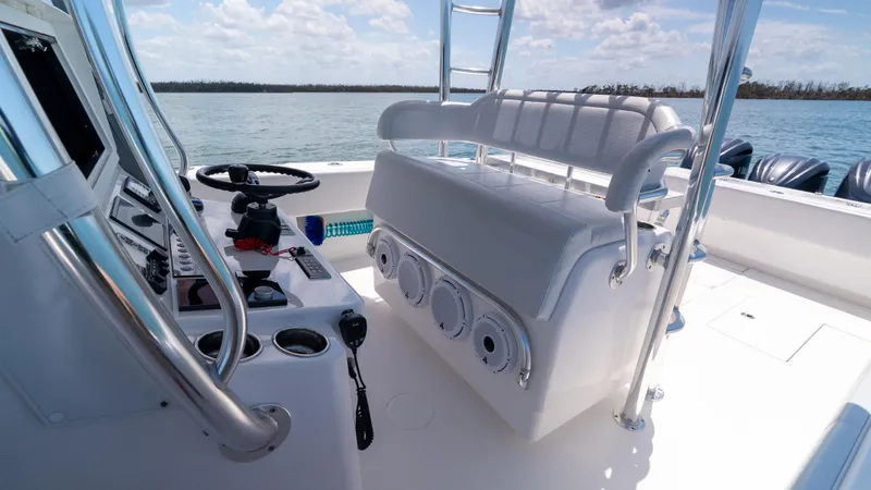  Yacht Photos Pics 2023 Contender 39 ST boat interior with helm, seating, and ocean view.