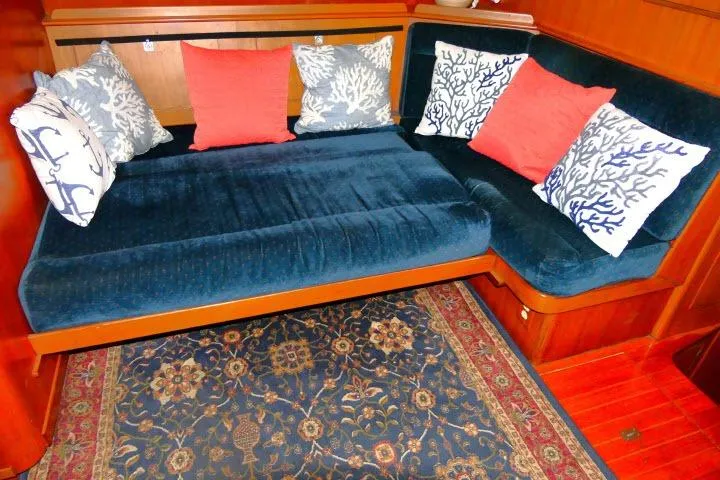 Avenir Yacht Photos Pics Cozy 1982 Ta Shing Mason 63 yacht interior with blue sofa and decorative pillows.