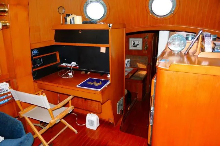 Avenir Yacht Photos Pics Interior of 1982 Ta Shing Mason 63 yacht with wooden furnishings and nautical decor.