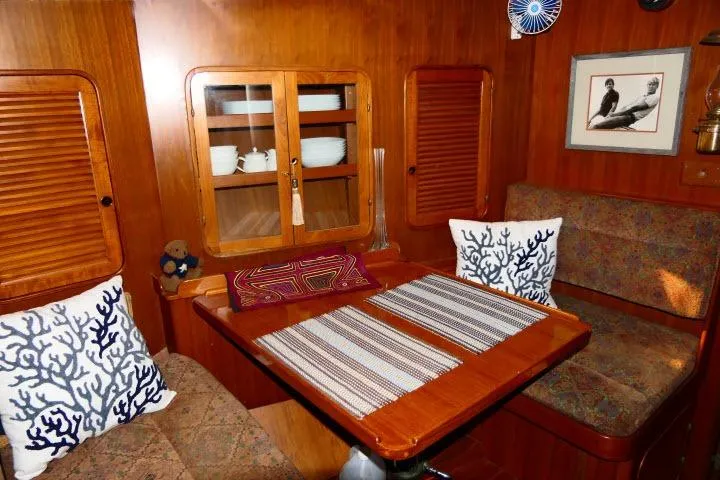 Avenir Yacht Photos Pics Cozy 1982 Ta Shing Mason 63 yacht interior with wooden dining area and nautical decor.