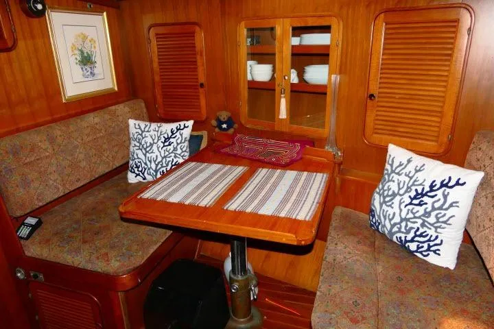 Avenir Yacht Photos Pics Cozy 1982 Ta Shing Mason 63 yacht interior with dining area and nautical decor.