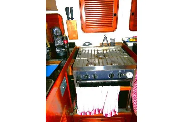 Avenir Yacht Photos Pics Galley kitchen in 1982 Ta Shing Mason 63 yacht with stove and utensils.