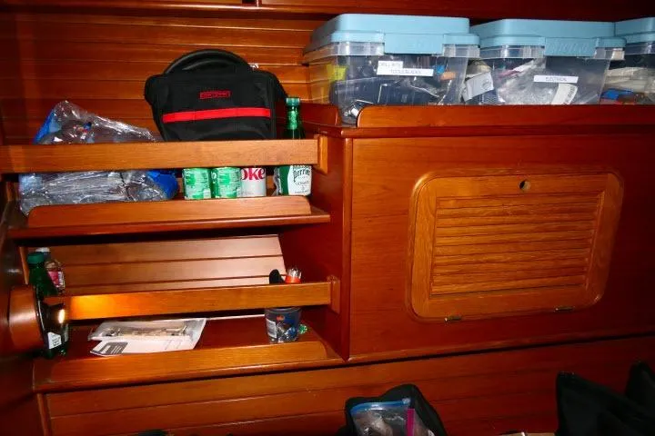 Avenir Yacht Photos Pics Interior storage of 1982 Ta Shing Mason 63 yacht with organized shelves and containers.