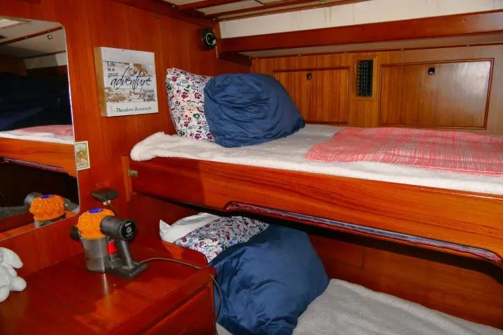 Avenir Yacht Photos Pics Interior of 1982 Ta Shing Mason 63 yacht with cozy wooden bunk beds.