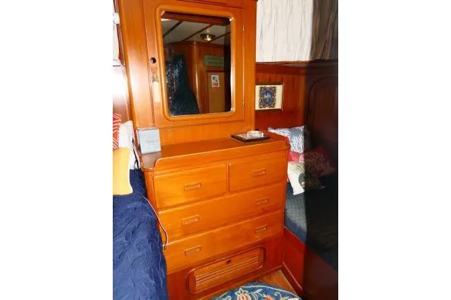 Avenir Yacht Photos Pics Wooden dresser with mirror in 1982 Ta Shing Mason 63 yacht interior.