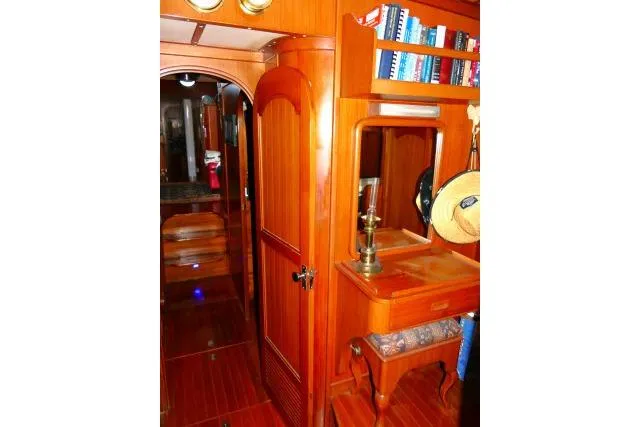 Avenir Yacht Photos Pics Interior of 1982 Ta Shing Mason 63 yacht with wooden cabinetry and nautical decor.