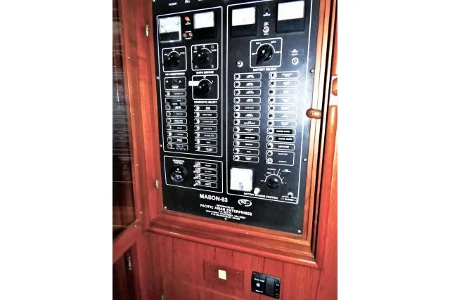 Avenir Yacht Photos Pics Electrical control panel on 1982 Ta Shing Mason 63 yacht, featuring switches and dials.