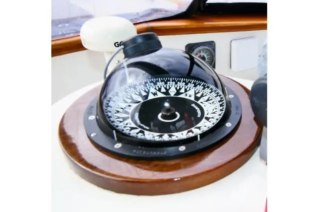 Avenir Yacht Photos Pics Compass on 1982 Ta Shing Mason 63 yacht, featuring a classic wooden mount.