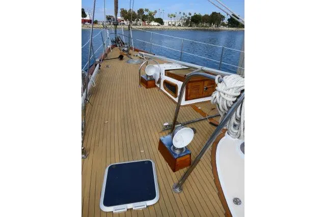 Avenir Yacht Photos Pics Deck of 1982 Ta Shing Mason 63 yacht with wooden finish and nautical equipment.