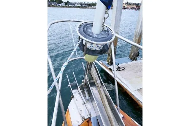 Avenir Yacht Photos Pics Bow of 1982 Ta Shing Mason 63 yacht with anchor and railing.