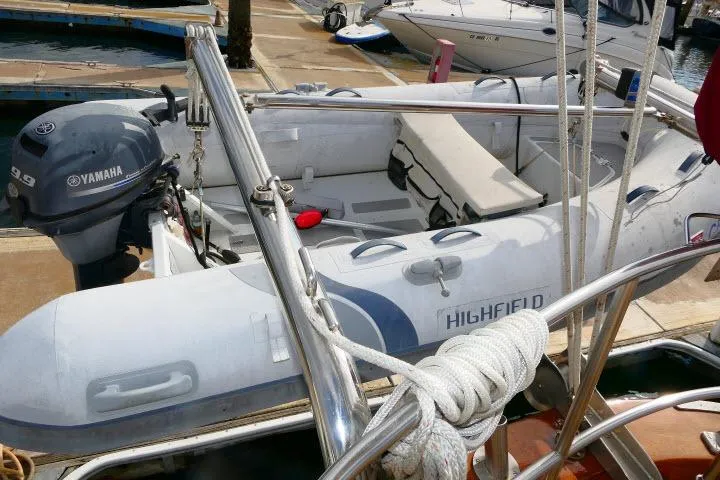 Avenir Yacht Photos Pics Inflatable boat with Yamaha motor docked near Ta Shing Mason 63 yacht, 1982 model.