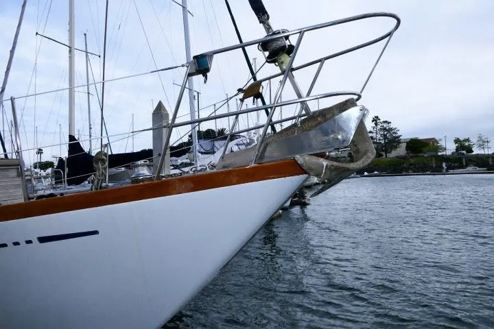 Avenir Yacht Photos Pics 1982 Ta Shing Mason 63 sailboat docked, featuring sleek bow design and nautical equipment.