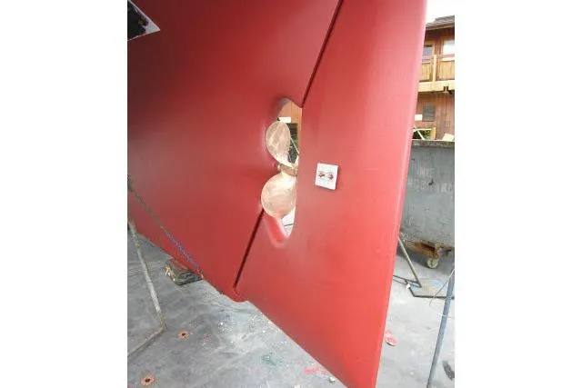 Avenir Yacht Photos Pics Red hull of 1982 Ta Shing Mason 63 sailboat, showcasing propeller aperture.