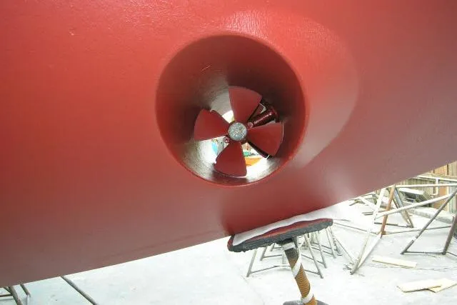 Avenir Yacht Photos Pics Red hull of 1982 Ta Shing Mason 63 yacht with visible propeller.