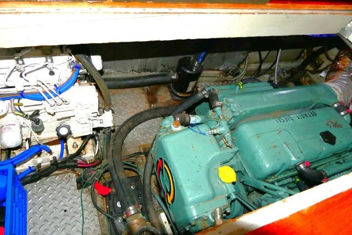 Avenir Yacht Photos Pics Engine compartment of 1982 Ta Shing Mason 63 sailboat, showcasing mechanical components and wiring.