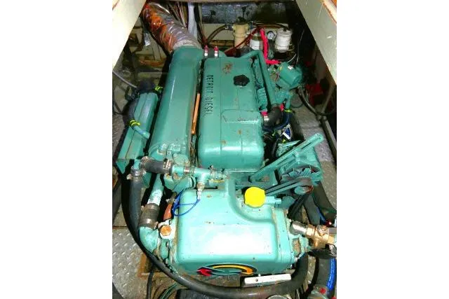 Avenir Yacht Photos Pics Engine compartment of 1982 Ta Shing Mason 63 sailboat, featuring a green marine engine.