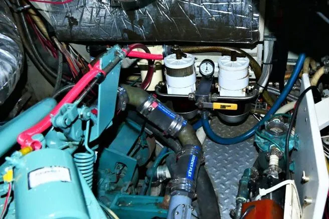 Avenir Yacht Photos Pics Engine room of 1982 Ta Shing Mason 63 yacht, showcasing mechanical components and piping.