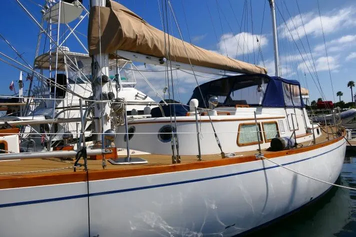 Avenir Yacht Photos Pics 1982 Ta Shing Mason 63 sailboat docked, featuring classic design and wooden accents.