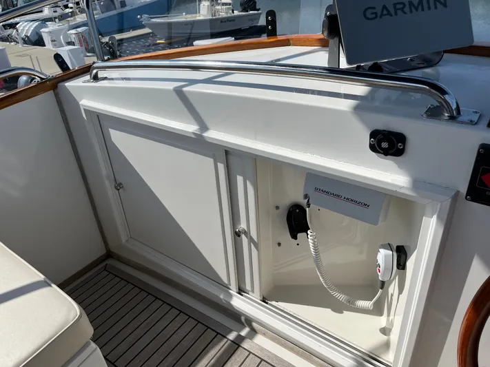  Yacht Photos Pics Interior view of a 1990 Grand Banks 32 Trawler with Garmin and Standard Horizon equipment.