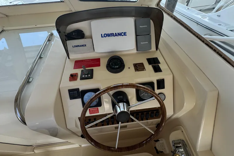  Yacht Photos Pics 2003 Mainship Pilot 34 helm with Lowrance and Raymarine navigation equipment.