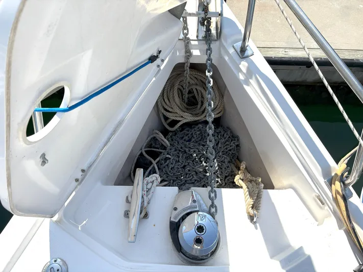 Bylgja Yacht Photos Pics Anchor locker of a 2005 Hunter 38 sailboat with ropes and chains.