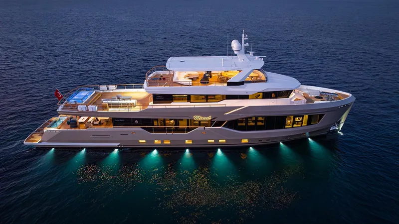 Numarine 40mxp Yacht Photos Pics Luxurious 2026 Numarine 40MXP yacht illuminated on the ocean at dusk.