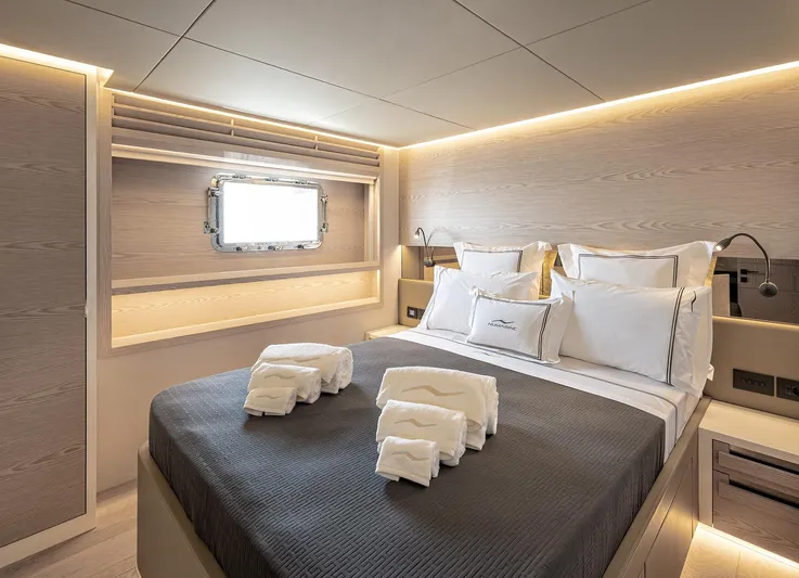 Numarine 40mxp Yacht Photos Pics Luxurious bedroom interior of 2026 Numarine 40MXP yacht with elegant bedding and modern lighting.