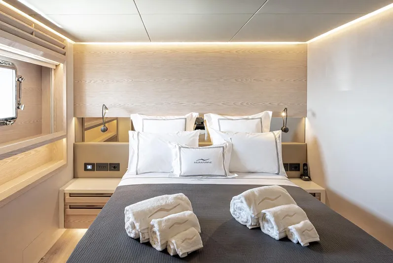 Numarine 40mxp Yacht Photos Pics Luxurious bedroom interior of 2026 Numarine 40MXP yacht with elegant bedding and ambient lighting.