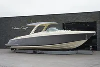 2024 Chris-Craft Launch 35GT boat displayed on a trailer outside a showroom.