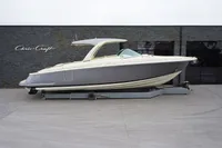 2024 Chris-Craft Launch 35GT boat displayed on a trailer outside a showroom.