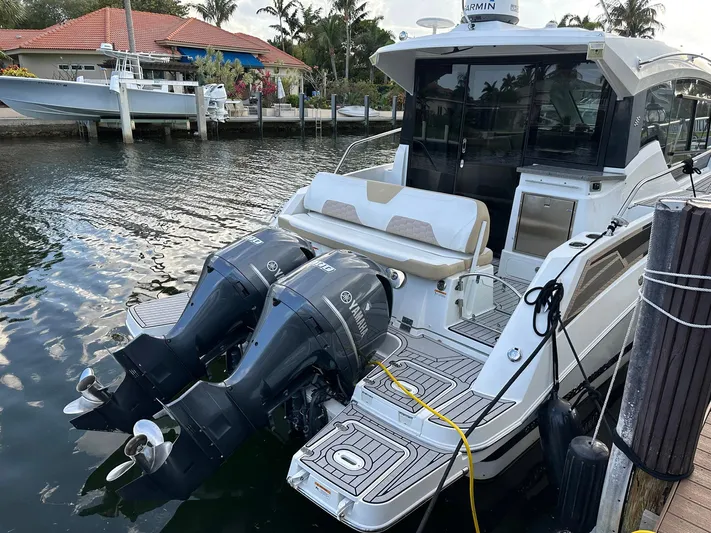 Olivia Yacht Photos Pics 2020 Four Winns Vista 355 Coupe docked with dual outboard engines.