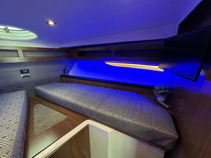 Olivia Yacht Photos Pics 2020 Four Winns Vista 355 Coupe cabin with modern lighting and sleek interior design.