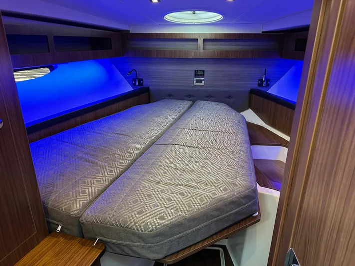 Olivia Yacht Photos Pics Luxurious interior cabin of 2020 Four Winns Vista 355 Coupe with ambient lighting.