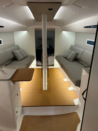  Yacht Photos Pics Interior of 2025 Beneteau First 30 sailboat with modern seating and sleek design.