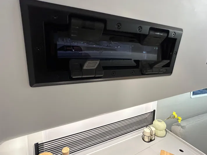  Yacht Photos Pics 2025 Beneteau First 30 interior detail with modern ventilation system and sleek design elements.