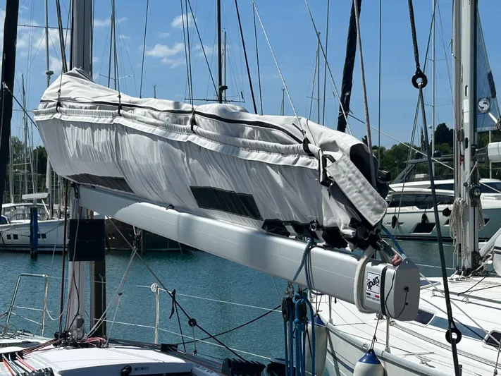 Yacht Photos Pics 2025 Beneteau First 30 sailboat mast and boom in marina setting.