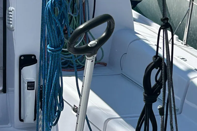 Yacht Photos Pics Cockpit of 2025 Beneteau First 30 sailboat with ropes and tiller.